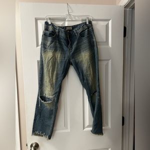 Free people cropped and distressed jeans.